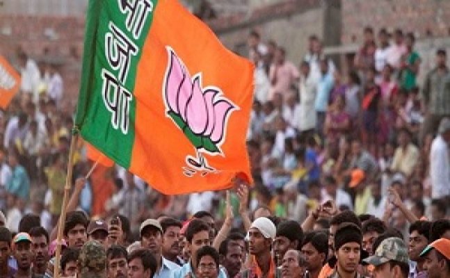 Image of the BJP flag in a political rally