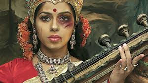 A battered Hindu Goddess Saraswati.